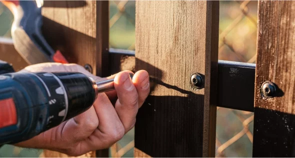 Image of someone repairing a fence