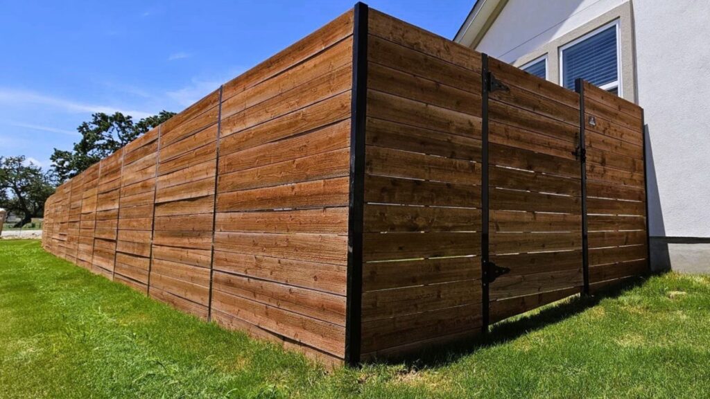 Outside of a pre-stained wooden fence