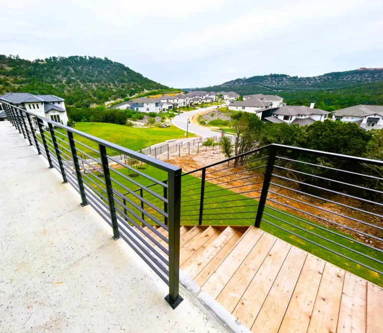 Cedar deck, custom iron, with a masonry exterior